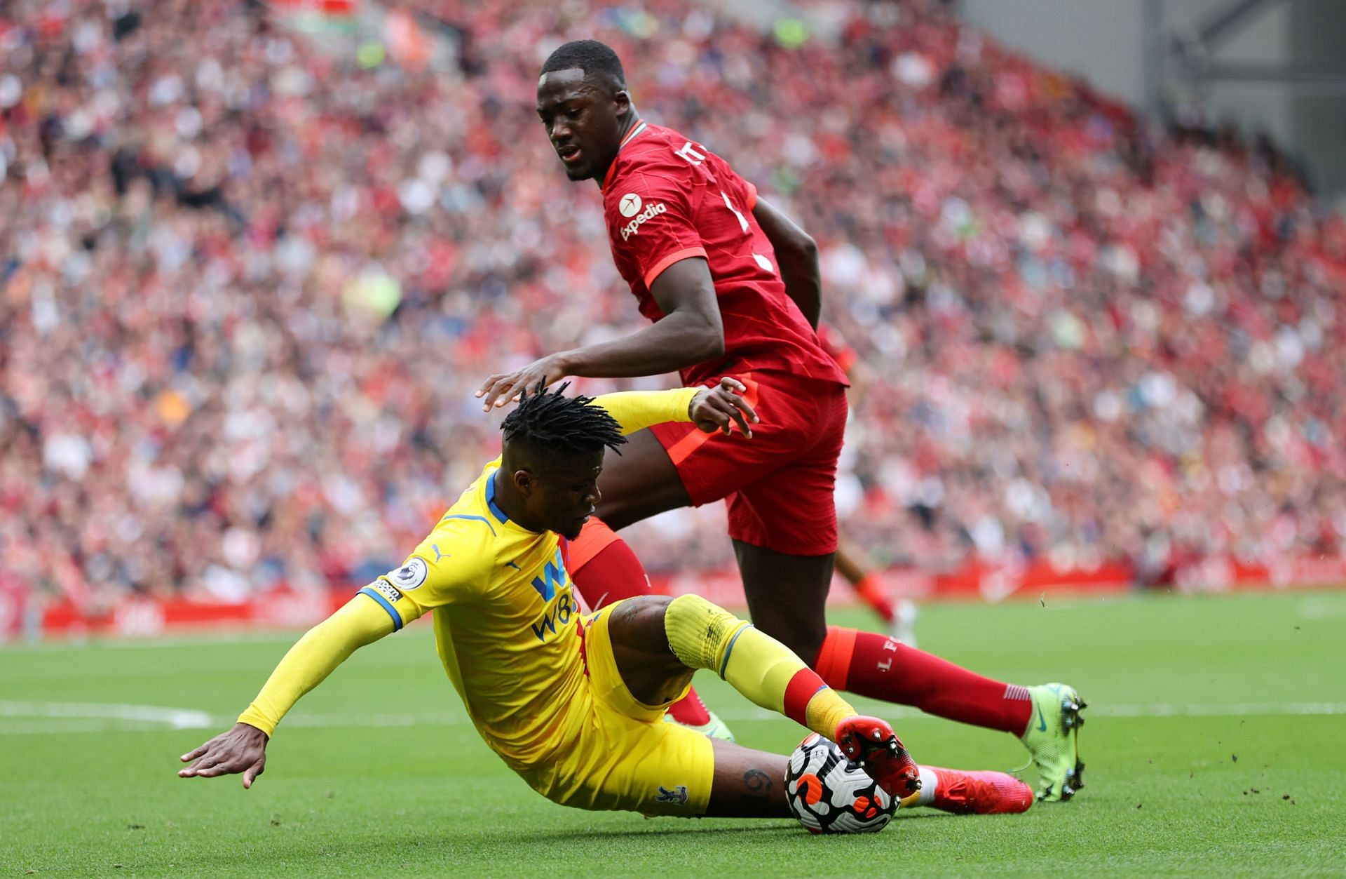 Liverpool's Ibrahima Konate (right) stops Crystal Palace's Wilfrid Zaha.